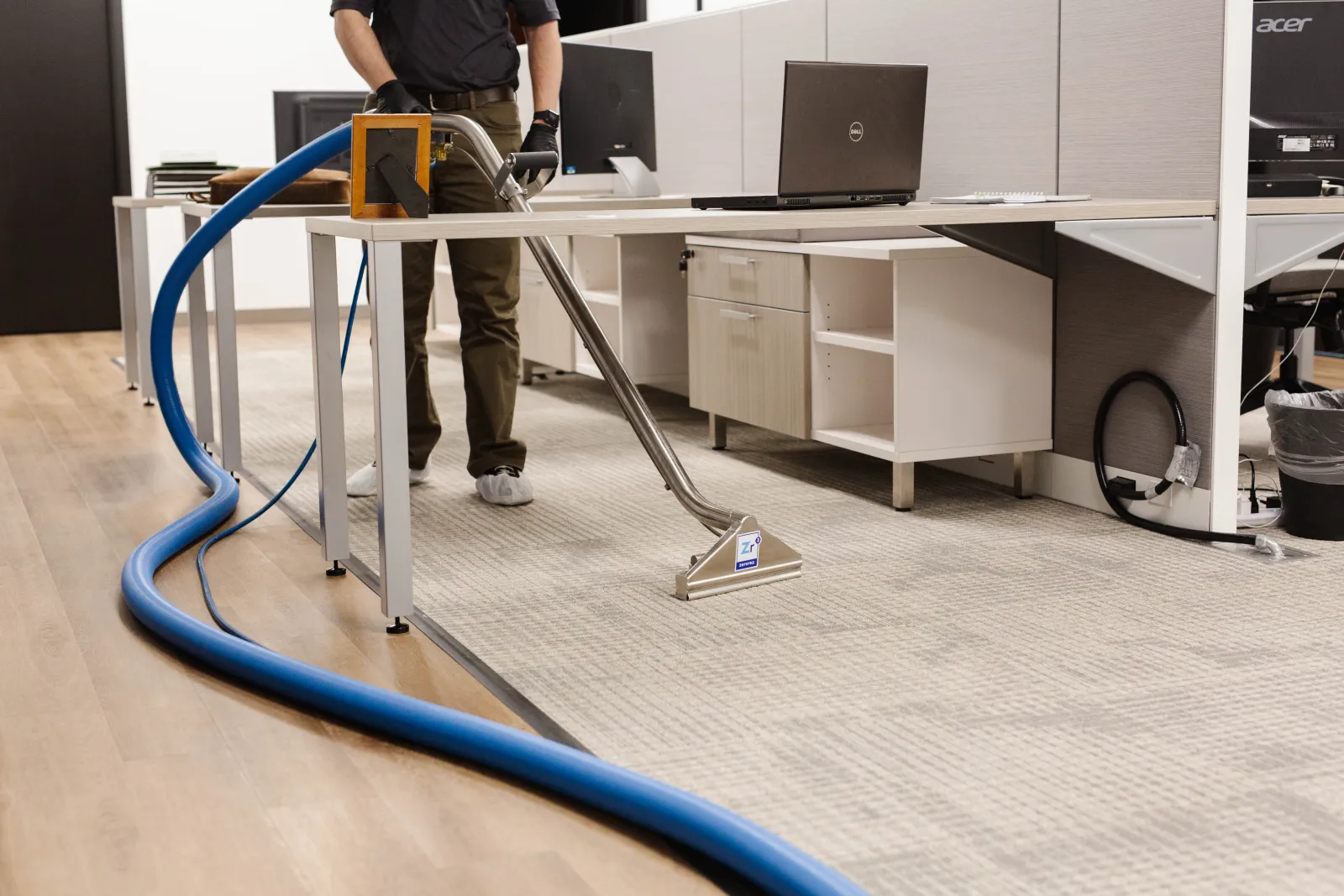 carpet cleaning technician cleaning office carpet