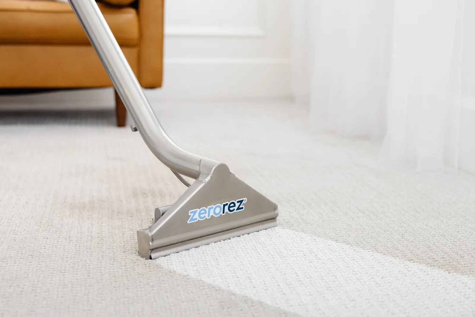 carpet cleaning wand on beige carpet